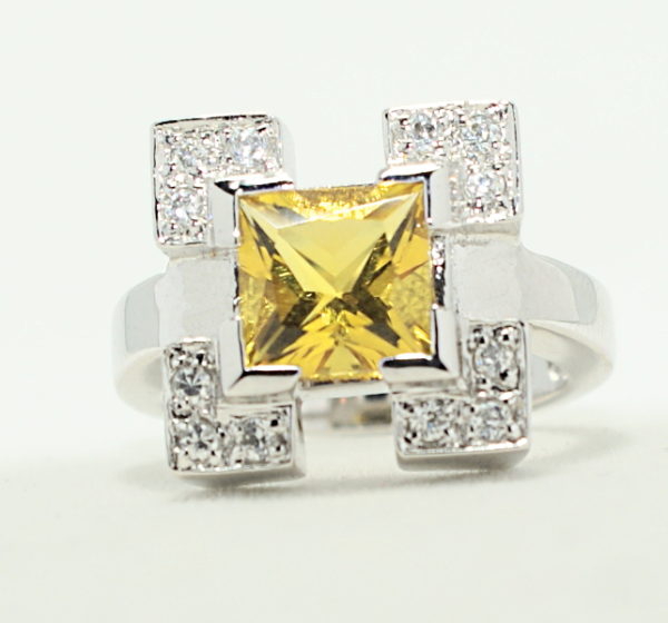 Silver square crystal frame ring with yellow princess gem center ring.