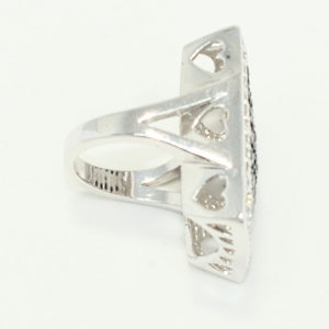 Sideview oversized silver ring with crystals and heart cut out gallery.