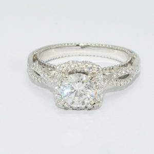 White gold Verragio ribbon engagement ring with round center diamond.