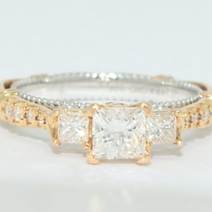 Verragio rose gold engagement ring with three princess cut diamonds.