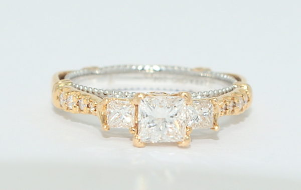 Verragio rose gold engagement ring with three princess cut diamonds.