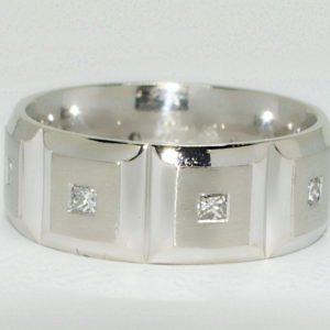 white gold mens ring with 8 evenly spaced square sections set with square diamonds