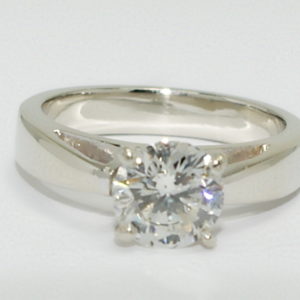 White gold solitaire round diamond engagement ring.