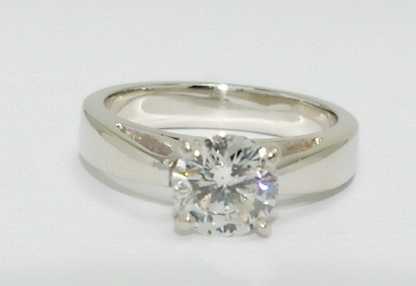 White gold solitaire round diamond engagement ring.