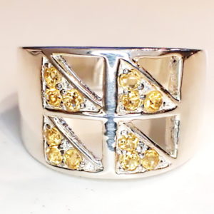 Sterling silver ring with window pane style top and citrine set diagonaly in each pane.