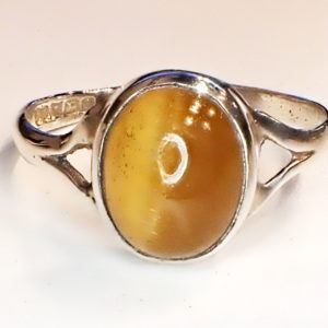 Sterling silver ring with oval cabochon cut tiger;s eye.