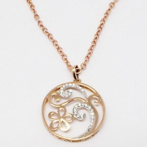 Rose gold floral circle necklace with diamonds.
