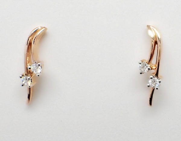 Rose gold double swoop earring set with two diamonds in each.