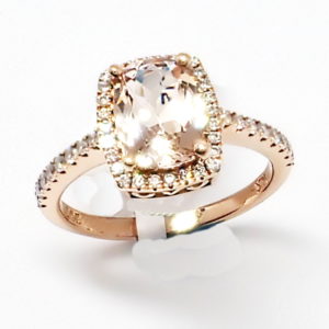 14kt rose gold dainty halo ring with peachy pink Morganite center and diamond accents